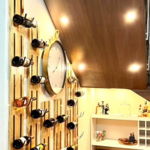 Garrafeira feita com madeira Pinho e suporte de barra de ferro.. Feito por baixo das escadas com um acabamento em Led para dar aquele toque final…